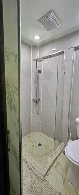 a shower with a glass door in a bathroom at Rincón de Paz in Jarabacoa
