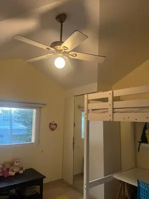 a bedroom with a ceiling fan and a bunk bed at Velero Beach Cabarete 2 bedroom Penthouse in Cabarete