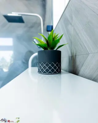 a plant sitting on top of a white table at Caribey2 APT 2A3 in Las Terrenas