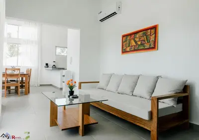 a living room with a couch and a table at Caribey2 APT 2A3 in Las Terrenas