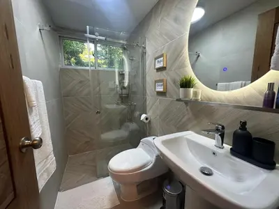 a bathroom with a toilet and a sink and a shower at Luxury 2 Bedroom Apartment, 1 Min Walk to Punta Popy Beach, Pool, AC, Fast WiFi, Las Terrenas in Las Terrenas