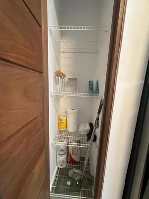 a closet with a shelf with food items in it at Luxury 2 Bedroom Apartment, 1 Min Walk to Punta Popy Beach, Pool, AC, Fast WiFi, Las Terrenas in Las Terrenas