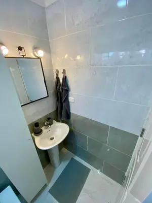 a bathroom with a sink and a mirror at D&L Apartment in Bayahibe