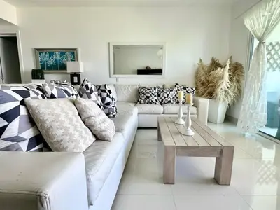 a living room with a couch and a coffee table at Luxury 1 Bedroom with Seaview Seawinds in Cabarete