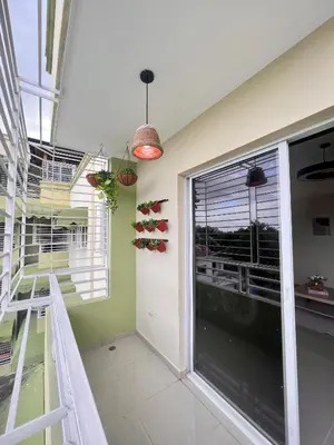 a room with a staircase and a large window at Condominio Emilia in Cancino