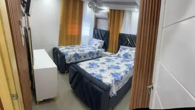 a small room with two beds and a couch at Amplio y Acogedor Apartamento Cerca de Todo in Juan López
