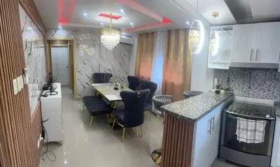 a kitchen and dining room with a table and chairs at Amplio y Acogedor Apartamento Cerca de Todo in Juan López