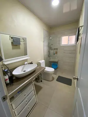 a bathroom with a sink and a toilet at 2BR & 2 WR ocean view Suite at Villa Costa Verde in Playa Cofresi, Puerto Plata, with a pool, big veranda, and a rooftop terrace in San Felipe de Puerto Plata