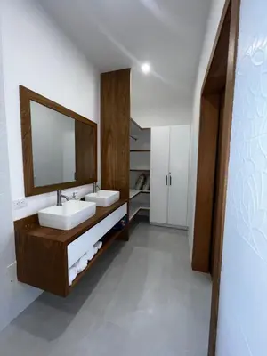 a bathroom with two sinks and a mirror at Villas Montemar - Villa Mar in Las Terrenas