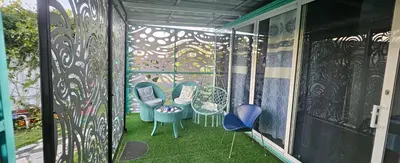 a balcony with chairs and a wall with graffiti at BlueEcolandia Bungalow AGUA in Jarabacoa