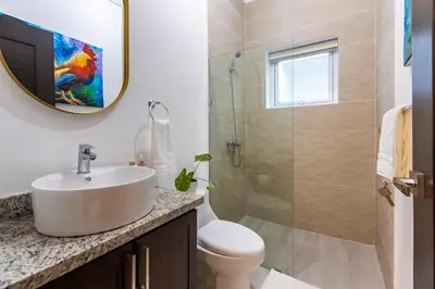 a bathroom with a sink and a shower at Villa Ruby Bella in Sosúa