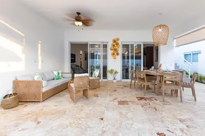 a living room with a couch and a table at Villa Ruby Bella in Sosúa