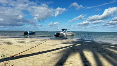 a boat in the water on the beach at Casa Ballenas3 SF in Las Terrenas