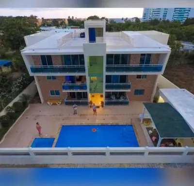 an aerial view of a building with a pool at Santuario Tropical at Marino Paradise in La Puntica de Juan Dolio