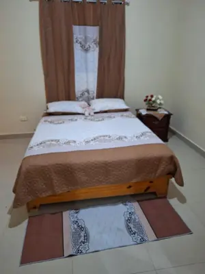 a bedroom with a large bed with a curtain at Casa Rural con Piscina in Azua de Compostela