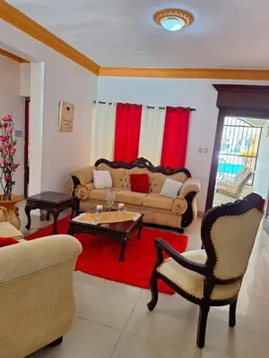 a living room with a couch and a table at Casa Rural con Piscina in Azua de Compostela