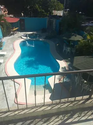 a view of a swimming pool from a balcony at Casa Rural con Piscina in Azua de Compostela