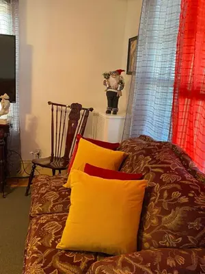 a bed with two pillows on it in a room at Rancho silvestre in Monte Plata