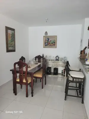 a dining room with a table and chairs at Romana Tropical in La Romana