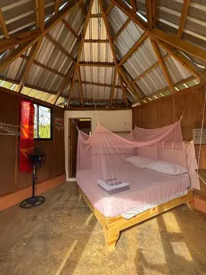 a bedroom with a bed in a tent at Atabeba in Las Galeras