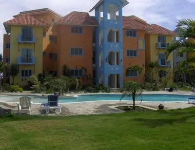 a large apartment building with a swimming pool at Blue fish apartamento in Sosúa