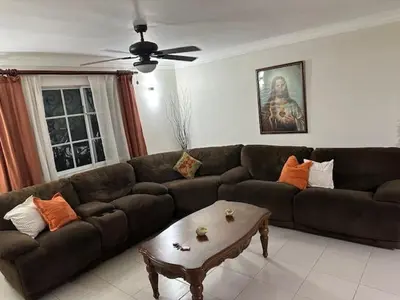a living room with a couch and a coffee table at Apartamento en Arroyo Hondo viejo in Santo Domingo
