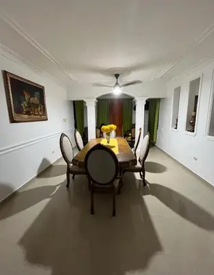 a dining room with a table and chairs at Encantadora Casa Familiar en Santiago in Santiago de los Caballeros