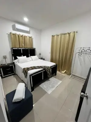 a bedroom with a large bed in a room at The Omelís House in Santa Bárbara de Samaná