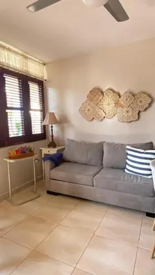 a living room with a couch and a table at Apartamento en Proyecto Frente al Mar en Sosua in Los Altos de Jalisco