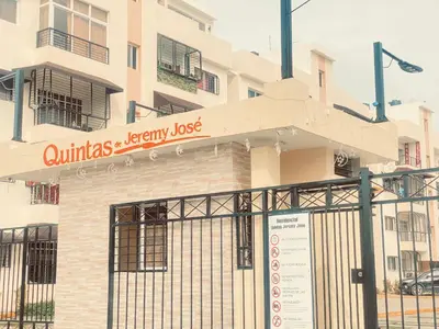 a building with a sign that reads olivias library loss at 13 de las Americas in La Alianza