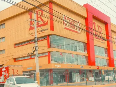 a building with a car parked in front of it at 13 de las Américas in La Alianza