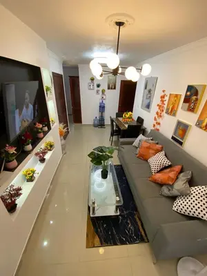 a living room with a couch and a table at 13 de las Américas in La Alianza