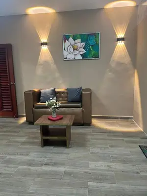 a living room with a couch and a coffee table at Hostal Bless house in San Pedro de Macorís