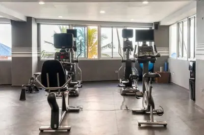 a gym with several exercise equipment in a room at Luxury Beachfront 2BR at Las Olas, Juan Dolio in La Puntica de Juan Dolio