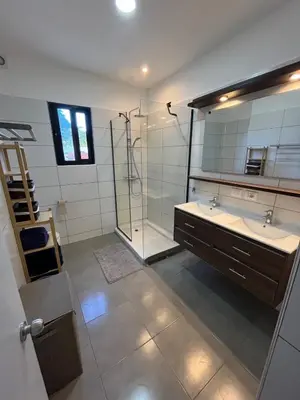 a large bathroom with two sinks and a shower at Brandnew 3 BR villa in Cabarete in Cabarete