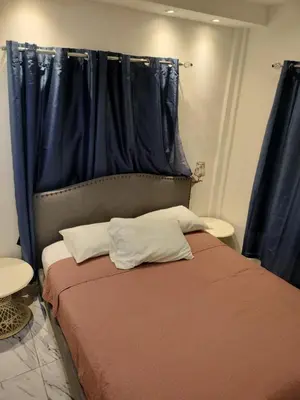 a bedroom with a bed with a blue curtain at Vacacional las pascualas in Sánchez
