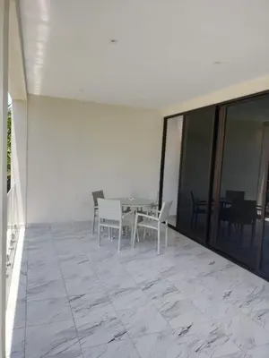 a patio with a table and chairs on a building at Vacacional las pascualas in Sánchez