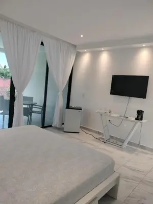 a bedroom with a bed and a flat screen tv at Vacacional las pascualas in Sánchez