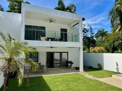 a white house with a patio and lawn at Villa Valentina Cabarete Procab in Cabarete