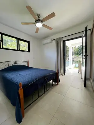 a bedroom with a bed and a ceiling fan at Villa Valentina Cabarete Procab in Cabarete