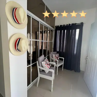 a room with two chairs and five stars on the wall at The Omelís House in Santa Bárbara de Samaná