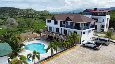an aerial view of a house with a pool at casita del padre pio in Punta Rucia