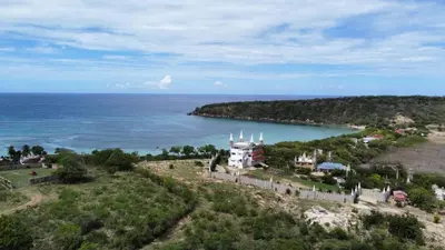 an aerial view of an island in the ocean at casita del padre pio in Punta Rucia