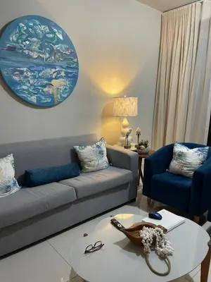 a living room with a couch and a table at modern y acogedor in San Felipe de Puerto Plata