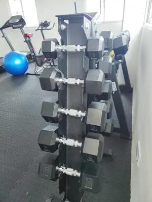 a pile of gray dumbbells in a gym at Lindo 1BD apt in Bella Vista with Pool, Rooftop,Gym,Parking in Santo Domingo