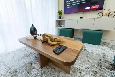 a room with a table with a pair of shoes on it at Modern 3BR! 9fl, King Bed! Sti!, in Santiago de los Caballeros