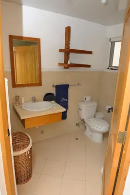 a bathroom with a toilet and a sink at 2BR 2BA Beachfront 63 in Bayahibe