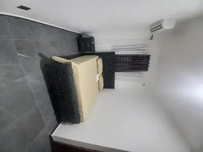 a kitchen with a refrigerator on a counter in a room at Andys Villa in Naime 3 in San Pedro de Macorís