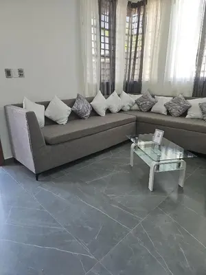a living room with a couch and a table at Andys Villa in Naime 3 in San Pedro de Macorís