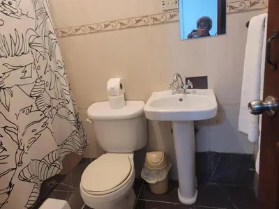 a bathroom with a toilet and a sink at Fantastic apartment 1Rooms zona colonial in Santo Domingo